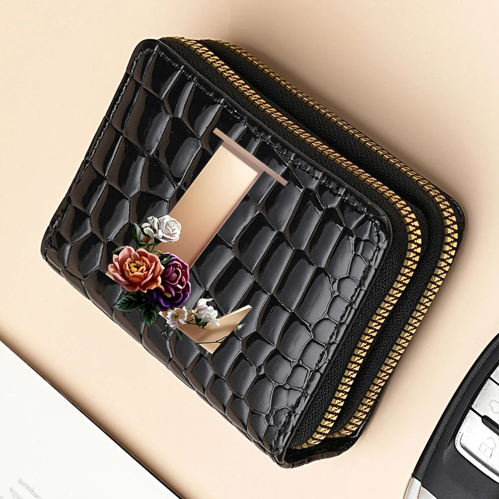 A black PU leather double-zip clutch wallet with a gold-colored zipper and a subtle floral accent.