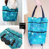 A teal floral patterned folding shopping trolley bag with black trim and handles.