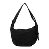 Black canvas crossbody shoulder bag shown from the front