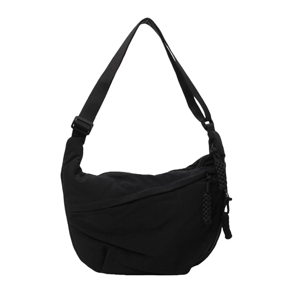 Black canvas crossbody shoulder bag shown from the front