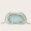A light blue, oval evening clutch bag with gold-tone hardware.