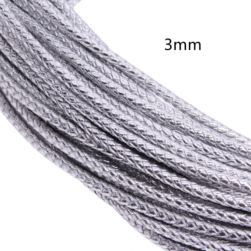 Close-up of a silver braided leather cord, 3mm in diameter.