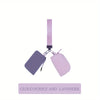 Elegant purple wristlet key card wallet with a pink strap and silver chain.