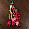 Aesthetic tulip flower bag charm keychain with green and red cord and pink fabric flowers
