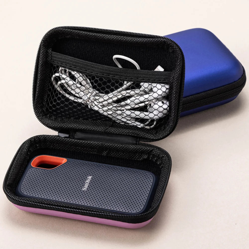 A black portable case with a blue outer shell and an inner compartment for a portable SSD.