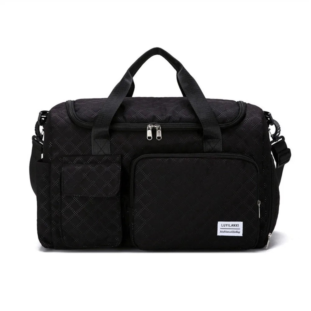 Black portable quilted travel duffle bag with carrying handles