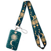 A teal patterned lanyard featuring crescent moon and sun designs, attached to a key ring.