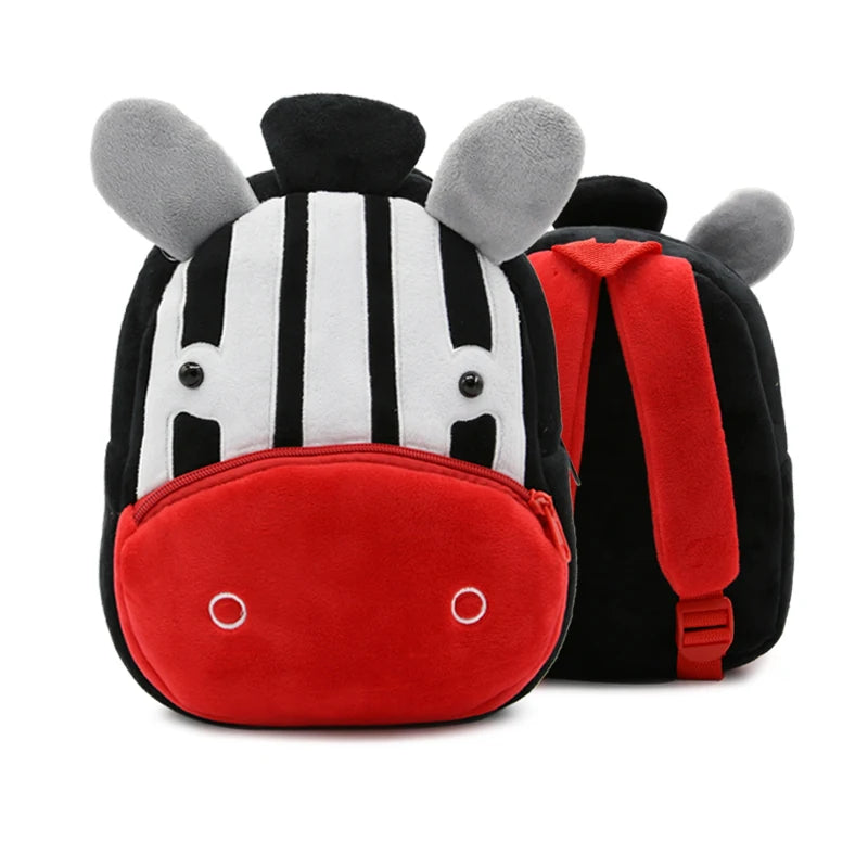 A plush backpack shaped like a zebra head with black and white stripes and gray ears, featuring a red nose and body.