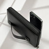 A black multi-card men's commuter wallet with a zipper and leather strap is shown against a bright background.