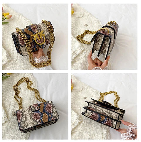 A close-up of an elegant retro crossbody bag in dark and gold patterned fabric being held by a hand.