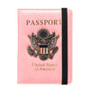 A pink leather passport holder featuring an embossed United States eagle badge.