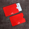 Two red RFID protection cards are shown on a dark surface, with one card displaying an RFID symbol.