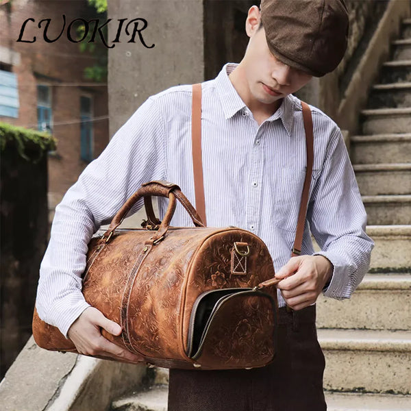 A young man holds a vintage embossed leather tote bag in front of an outdoor staircase.