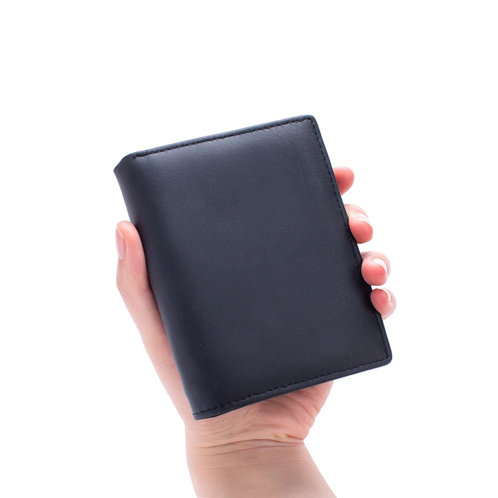 A hand holds a black genuine leather men's business wallet with a zipper.