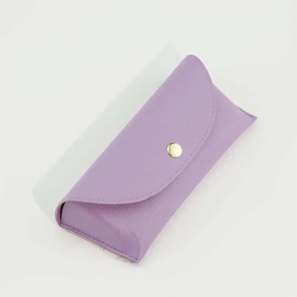 A purple PU leather hard shell sunglasses case lying on a white surface.