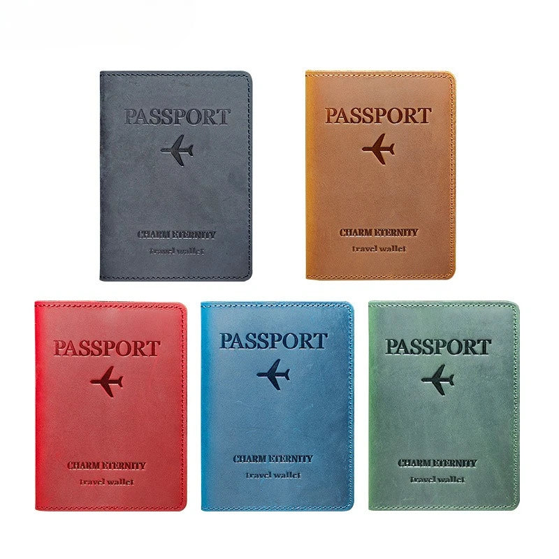 Four passport holders in different colors including gray brown red blue and green leather wallets
