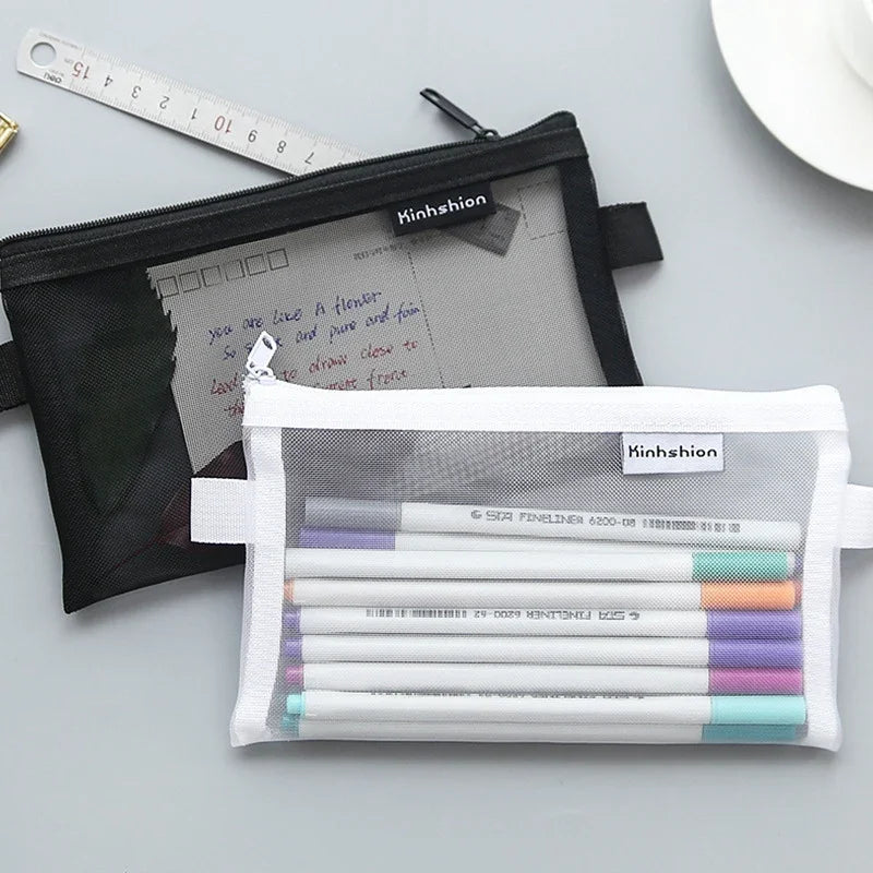 A clear mesh zipper pouch filled with various colored fine liners and a piece of paper.