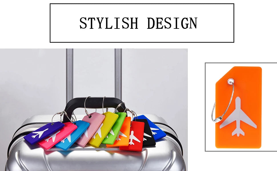 Colorful silicone luggage tags with airplane designs displayed on a silver suitcase.