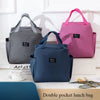 A set of three insulated canvas tote bags in gray, pink, and blue are displayed on a white surface.