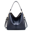 A black vintage faux leather hobo shoulder bag with gold hardware shown from the front.