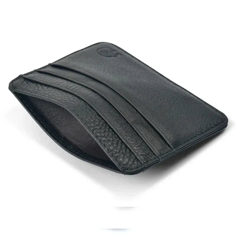A black genuine leather slim card holder wallet shown from above.