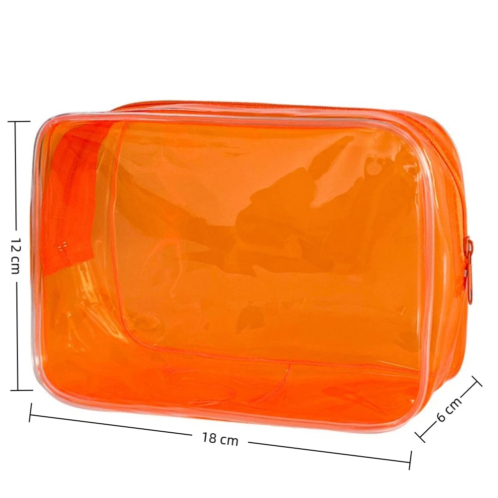 An orange transparent PVC travel makeup bag with a zipper closure, shown from the top view.