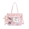 A pink Y2K punk goth crossbody bag with a mesh front and pink strap.