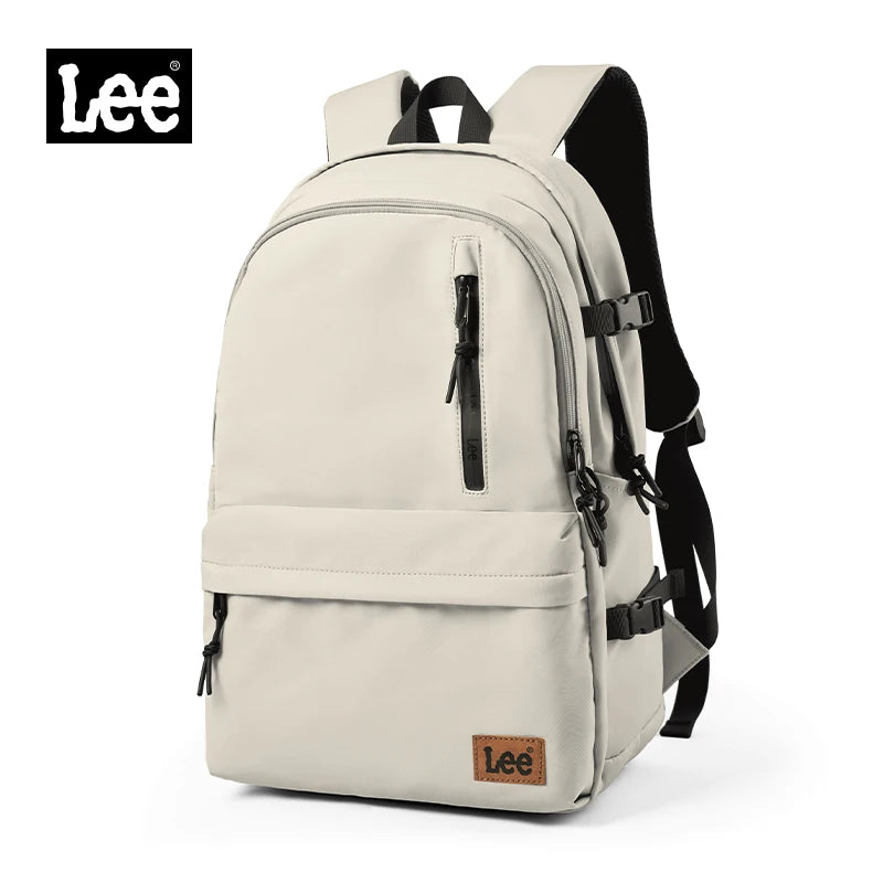 A beige Lee oxford school backpack with a black strap and laptop sleeve.