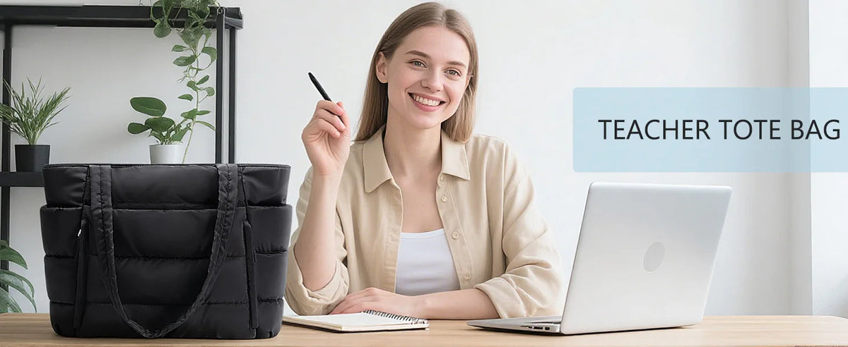 A smiling woman holds a black quilted tote bag next to a silver laptop on a wooden desk.