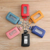 A collection of five Korean style leather car key cases in various colors and finishes, featuring transparent windows.