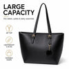 Bolso tote de cuero PU negro con dije dorado y detalle de pompon negro