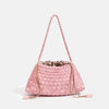 A pink handwoven PU shoulder bag with a woven texture and a long strap is shown against a white background.