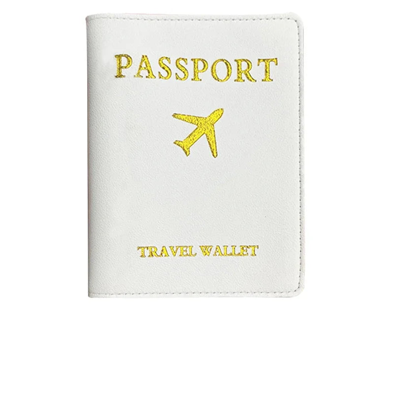 A white PU leather passport holder with gold foil printing of an airplane symbol and the words PASSPORT and TRAVEL WALLET.