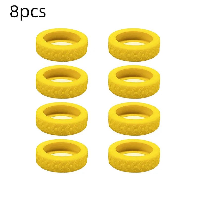 A set of eight yellow silicone luggage wheel protection rings.