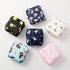 A collection of various cute compact sanitary pad storage pouches in floral and animal prints.