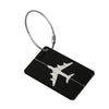 A black durable aluminum luggage tag with a silver cord attached.