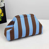 A striped knit makeup bag featuring brown and light blue horizontal stripes.