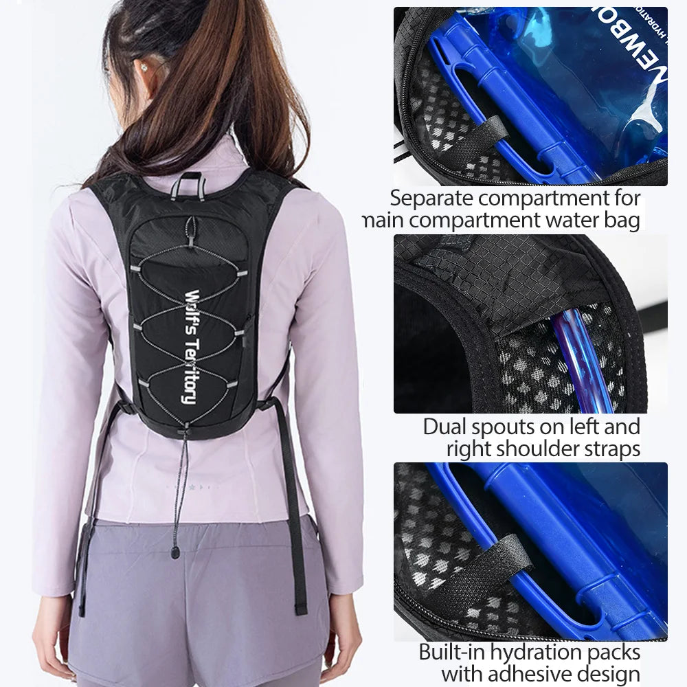 Black hydration running vest with separate compartments and dual shoulder straps worn by a woman.