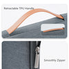 Close-up of a laptop sleeve showing a retractable TPU handle and a smooth zipper detail.