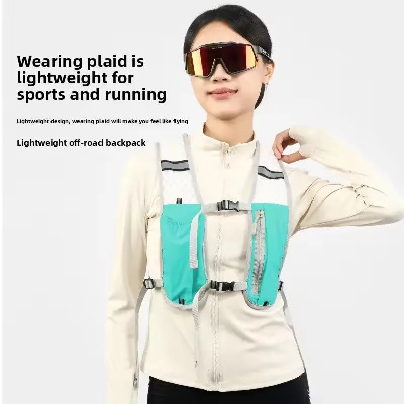 A woman wearing a white long-sleeved shirt and sunglasses is demonstrating a lightweight off-road backpack hydration vest.