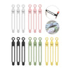 A collection of silicone cable ties and cord organizers in various colors including white, pink, black, and yellow.