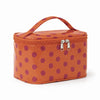 Bolsa de almacenamiento cosmético naranja con asa marrón y lunares rosas.