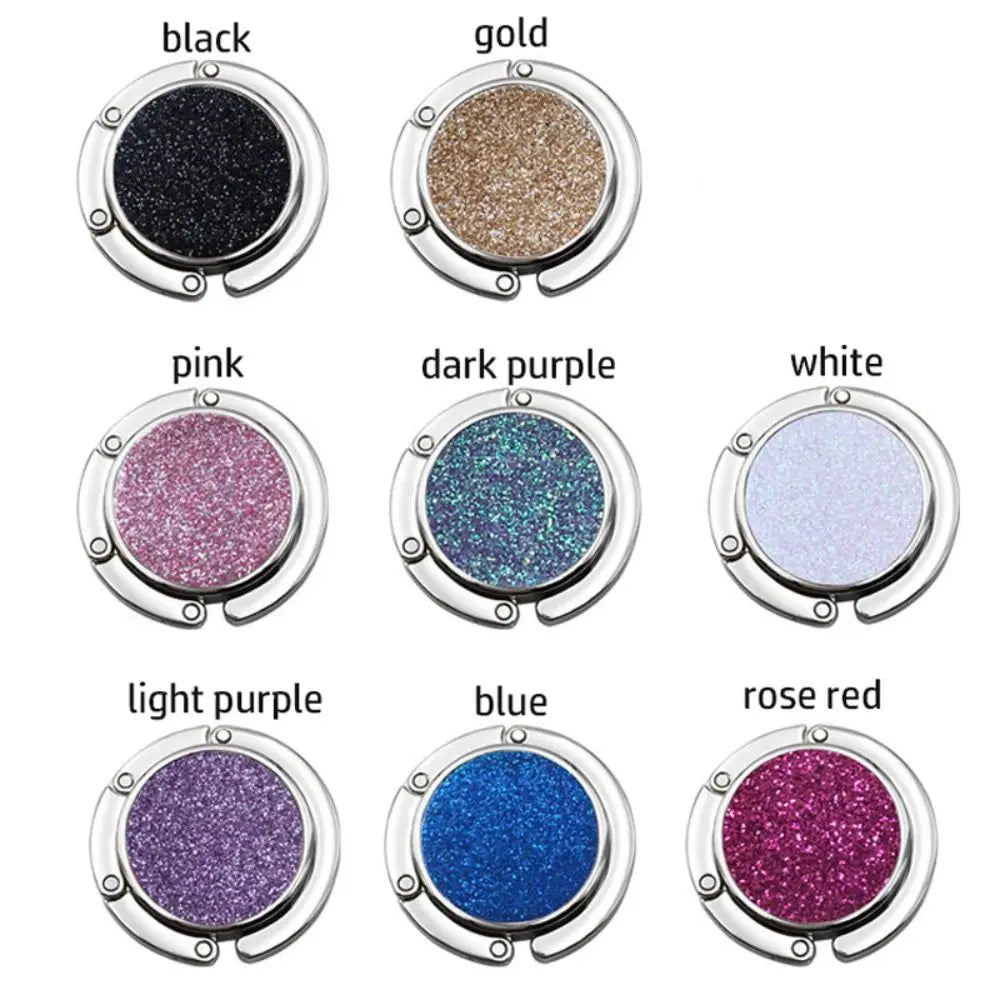 A collection of twelve round cosmetic palettes featuring various glitter eyeshadow colors including black, gold, pink, dark p