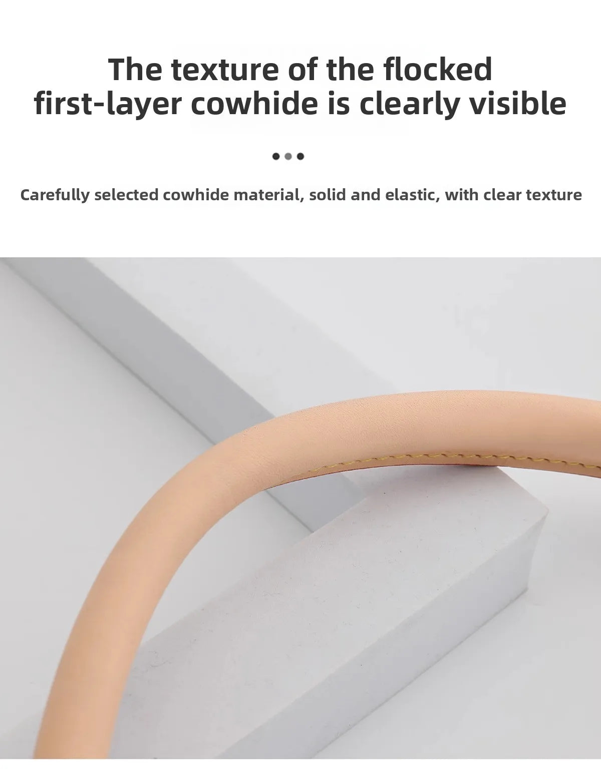 Close-up view of a light tan cowhide leather replacement shoulder strap with visible texture.