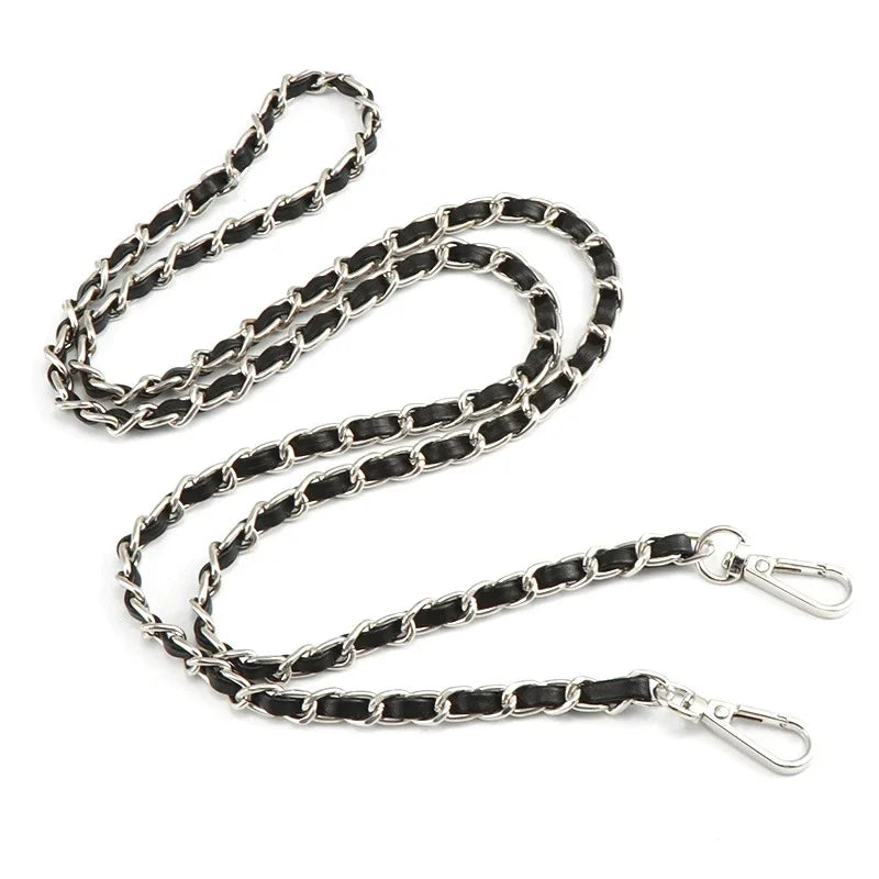 A silver and black metal chain shoulder strap for crossbody bags.
