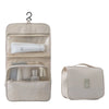 Beige tragbare Reise-Toilettenorganizer-Tasche mit klarem Fenster und Reißverschlussfach.
