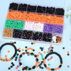 A collection of colorful polymer clay bracelets in various colors and textures displayed in a clear plastic tray.