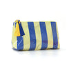 A yellow and blue striped cosmetic travel pouch with a gold fringe detail.