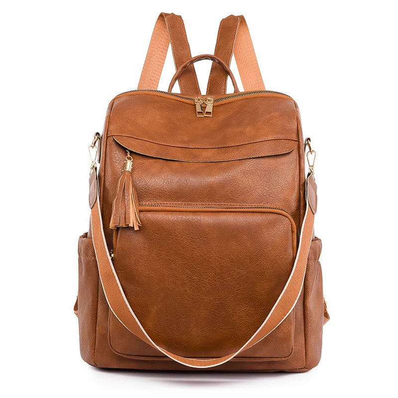 A brown leather vintage tassel backpack with anti-theft features is shown from the back.