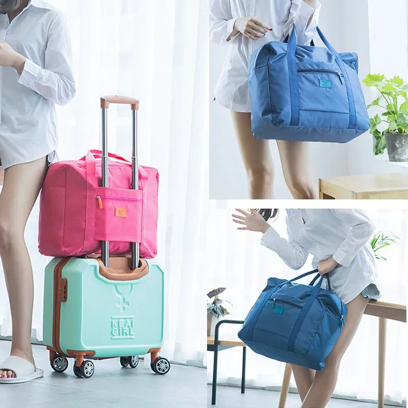 A woman is shown with a pink foldable travel duffel bag and a light green rolling suitcase.